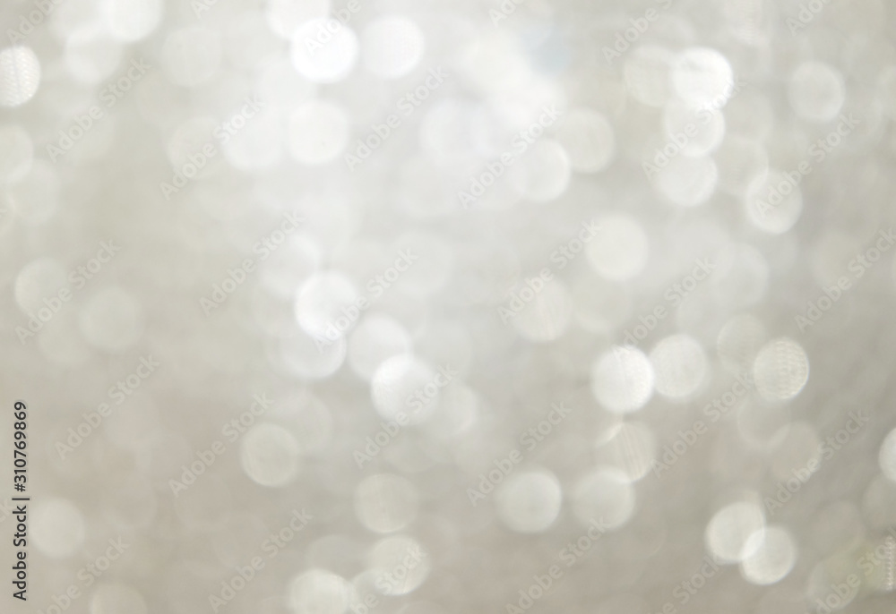 Background from silver Christmas sparkles, bokeh, blur, christmas background.
