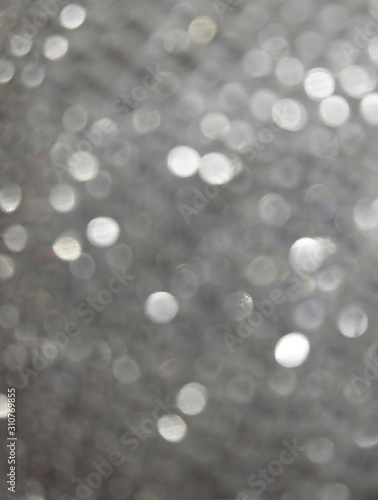Background from silver Christmas sparkles, bokeh