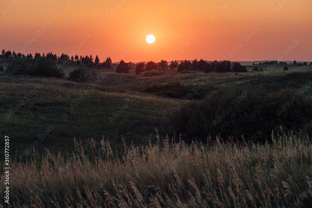 sunset over field sunset over field