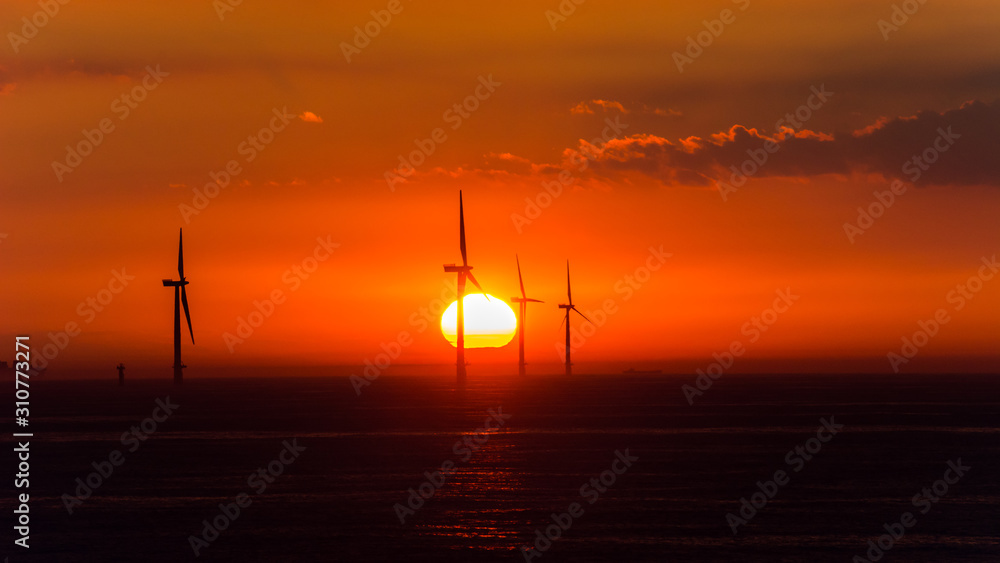 wind turbines from the Northern Sea in the sunset