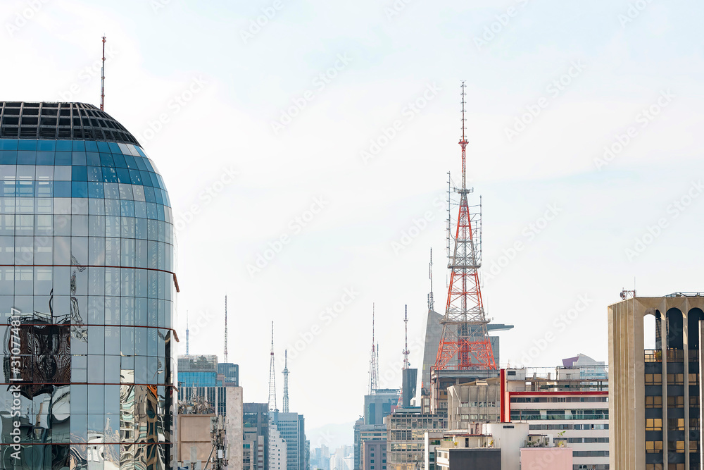 Communication antennas on top of tall buildings. Buildings of Paulista avenue, Sao Paulo SP, Brazil.
