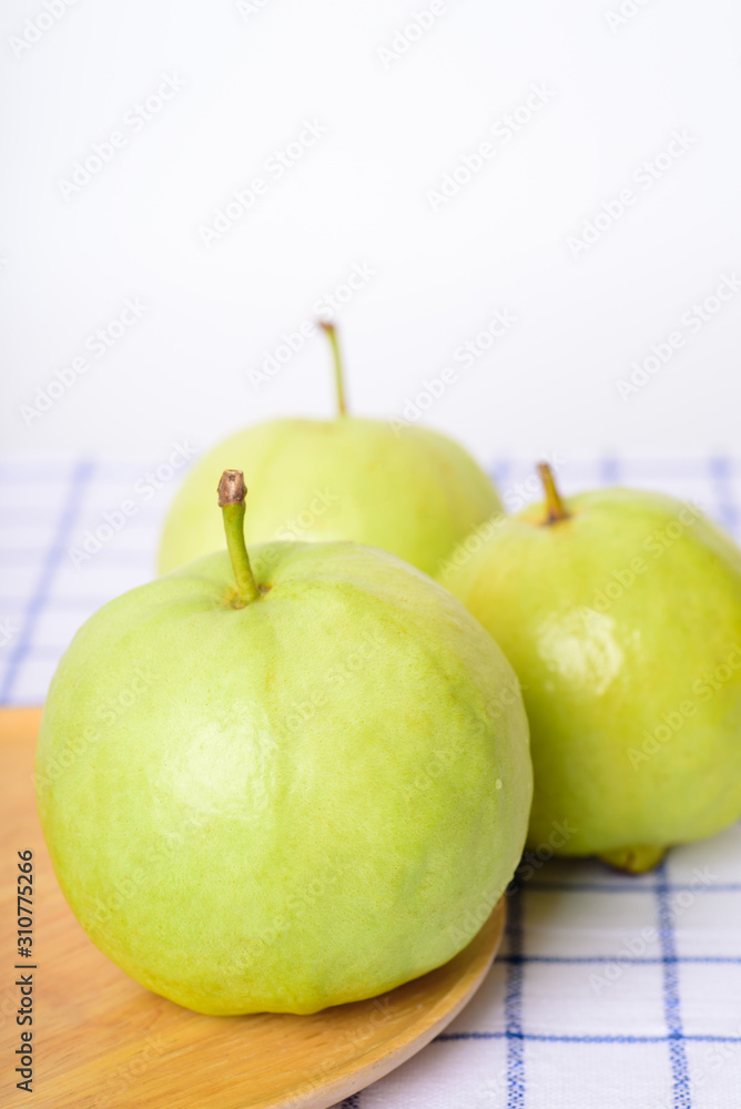 Fresh organic guava tropical fruit on white background. Healthy food high vitamin C concept Fresh organic guava tropical fruit on white background. Healthy food high vitamin C concept