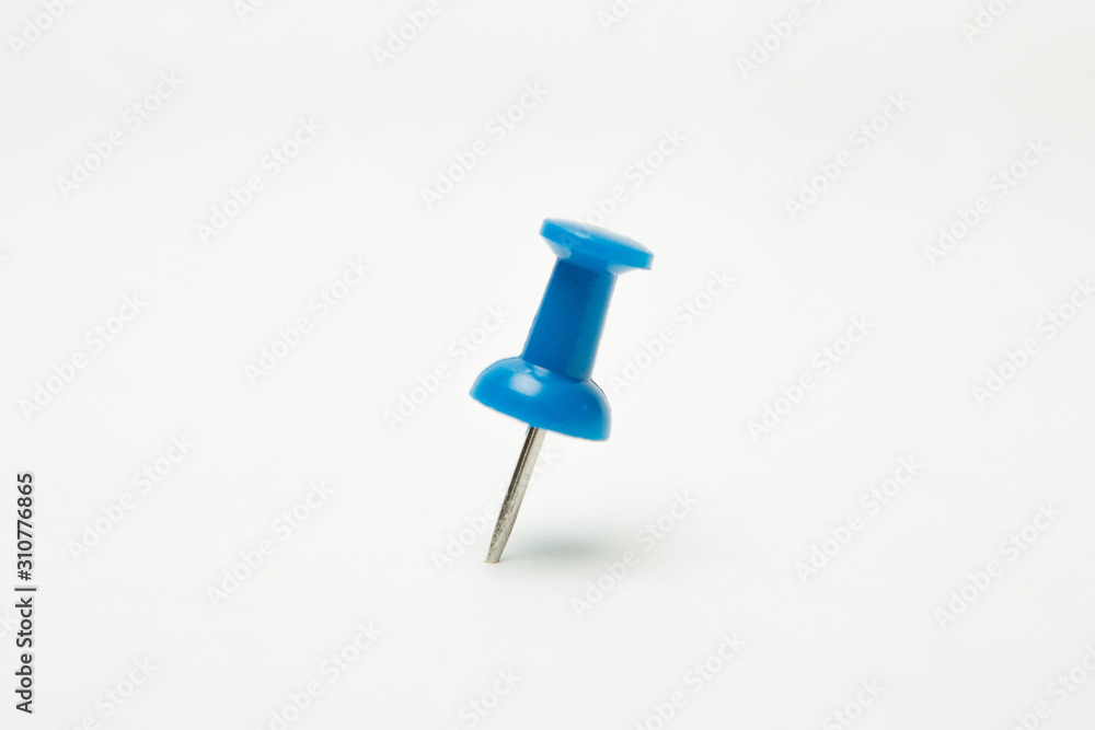 Close up of Blue pin on white background Close up of Blue pin on white background