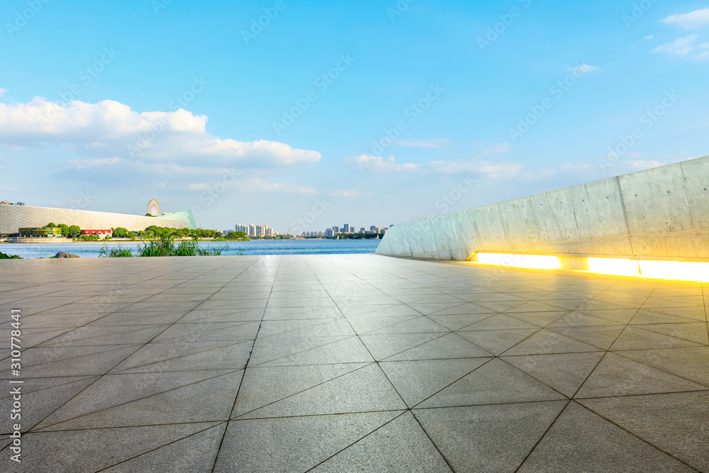 Suzhou city skyline and empty square floor landscape at sunset.
