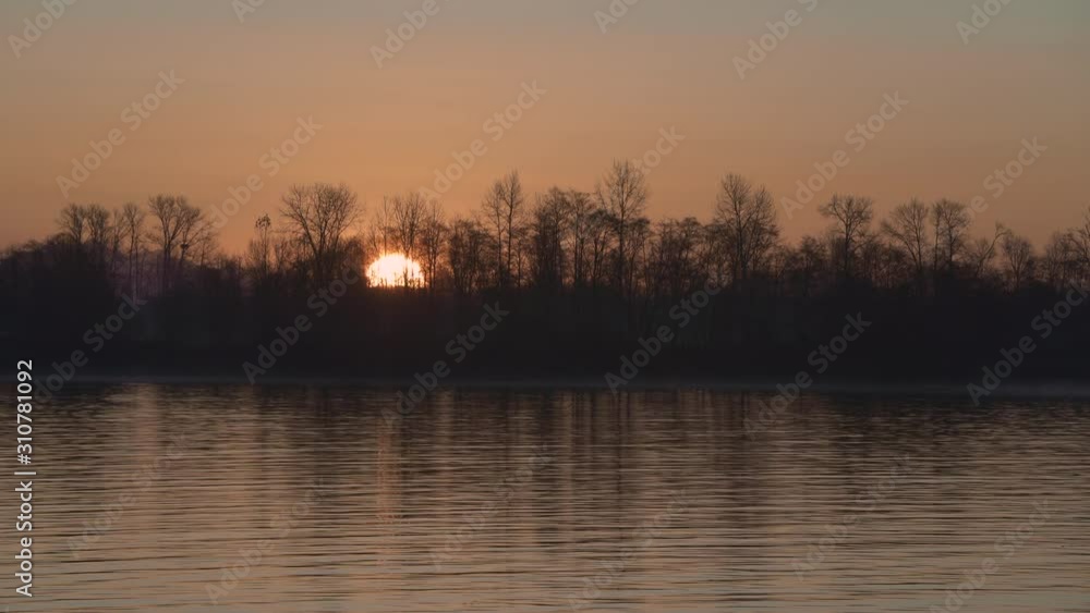 River Sunrise 4K UHD. Sunrise over the Fraser River in the mist. Timelapse. Richmond, British Columbia, Canada. 4K. UHD. River Sunrise 4K UHD. Sunrise over the Fraser River in the mist. Timelapse. Richmond, British Columbia, Canada. 4K. UHD.