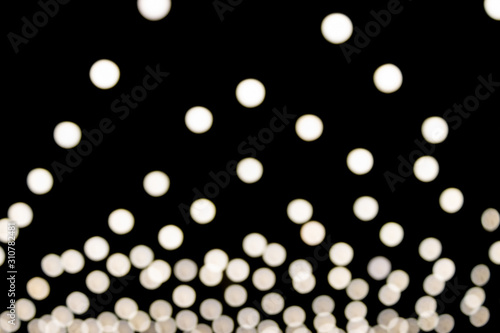Cuadro en lienzo White Triangle Shape Blurred Lights on Black Background