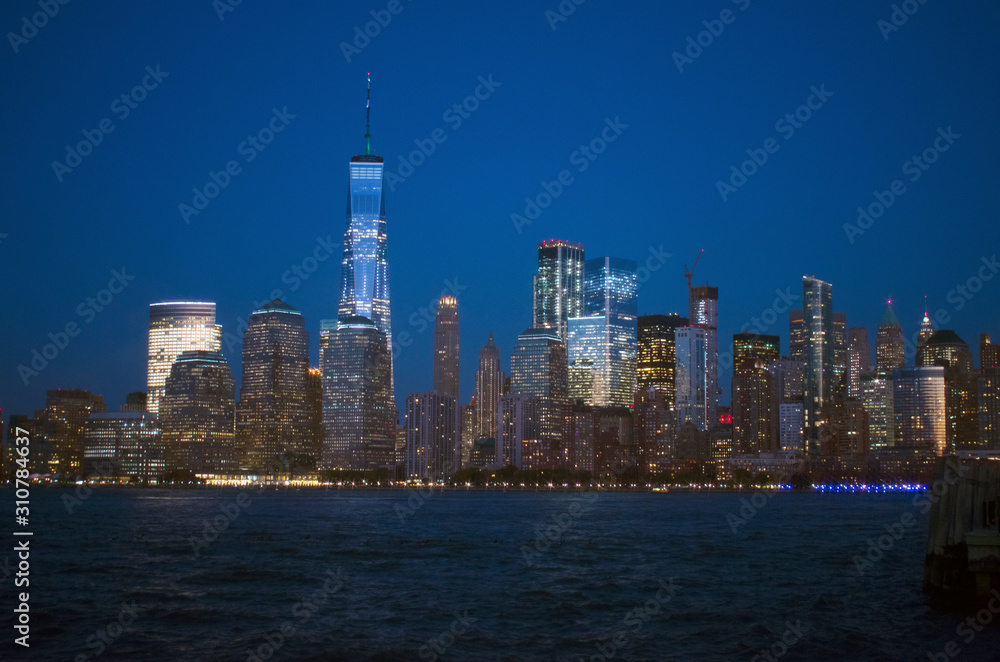 Nighttime view of the waterways of lower Manhattan and the World Financial Center from Liberty State Park in Jersey City, New Jersey -03