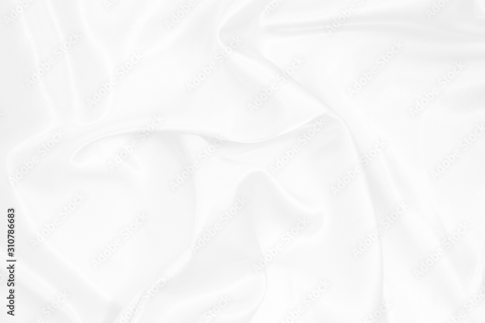Obraz premium White fabric background with soft waves.