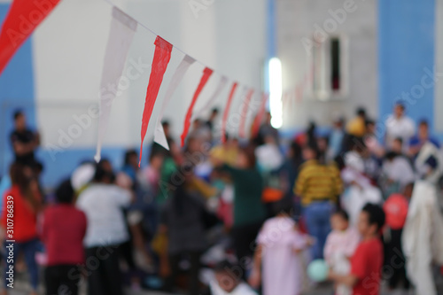 selected focus, Hanging party flags, blurred people background.