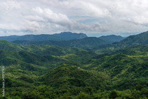 beautiful blue sky high peak mountains mist fog wildlife green forest at Khao Koh, Phu Tub Berk, Phetchabun, Thailand guiding idea long weekend for backpacker camping campfire relaxing hiking