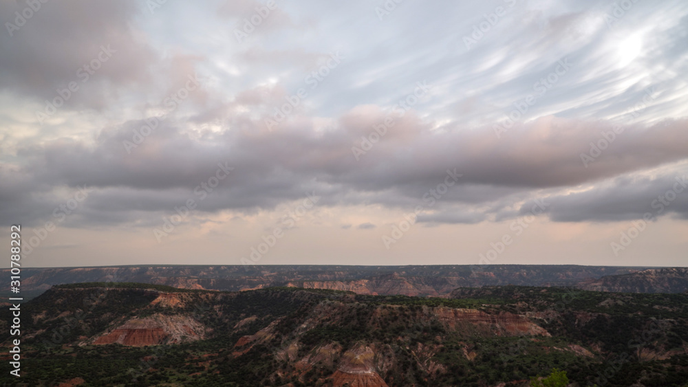 Palo Duro Canyon in Texas viewing mammatus clouds as they appear during colorful sunset.