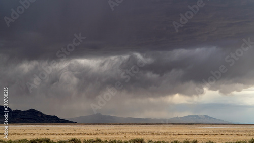 Storm dumping rain on the dry desert in Utah over the Bonneville Salt Flats near Fish Springs.