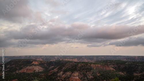 Palo Duro Canyon in Texas viewing mammatus clouds as they appear during colorful sunset.