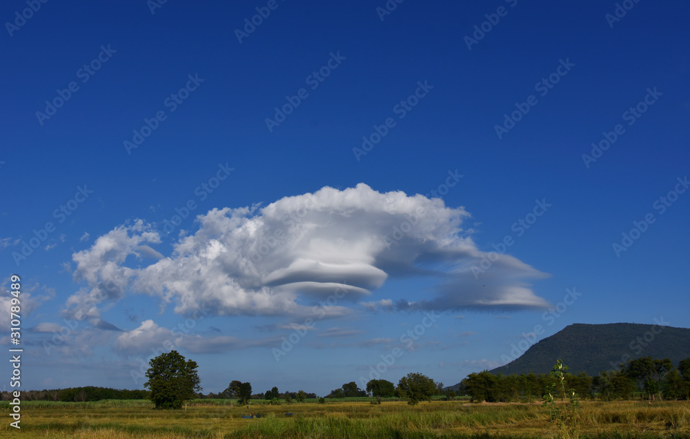Lenticular Wind Cloud Resembling A Ufo Flying Saucer Over Mountain In Countryside , Thailand Lenticular Wind Cloud Resembling A Ufo Flying Saucer Over Mountain In Countryside , Thailand