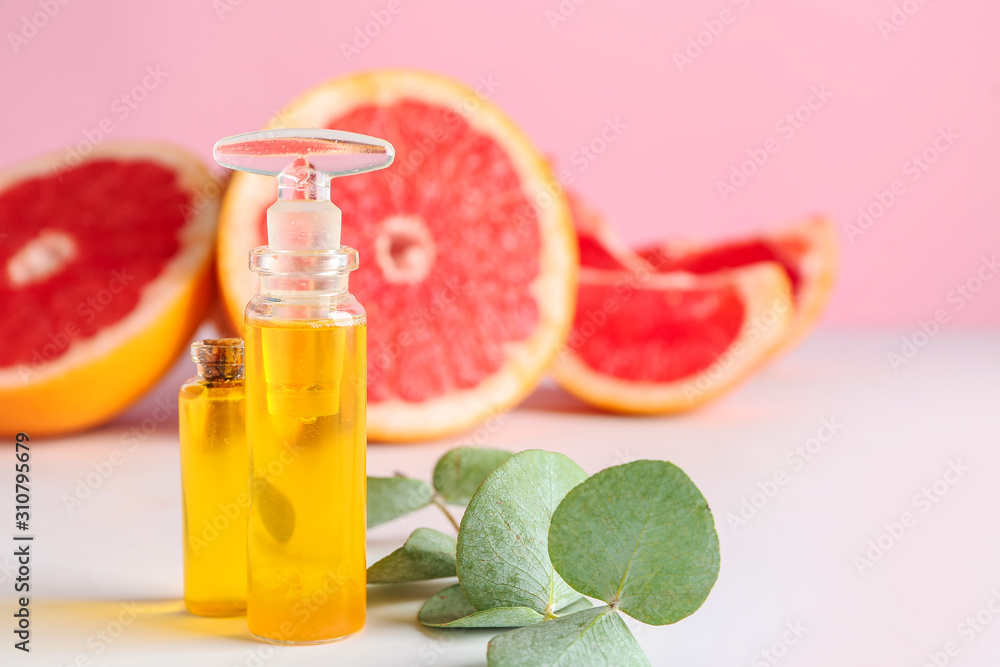 Bottles of grapefruit essential oil on table Bottles of grapefruit essential oil on table