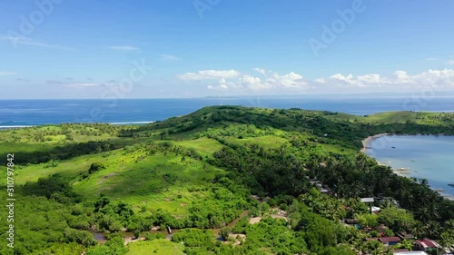 Basot Island, Caramoan, Camarines Sur, Philippines. Lighthouse on a tropical island. Beautiful landscape with a green island. Summer and travel vacation concept. photo