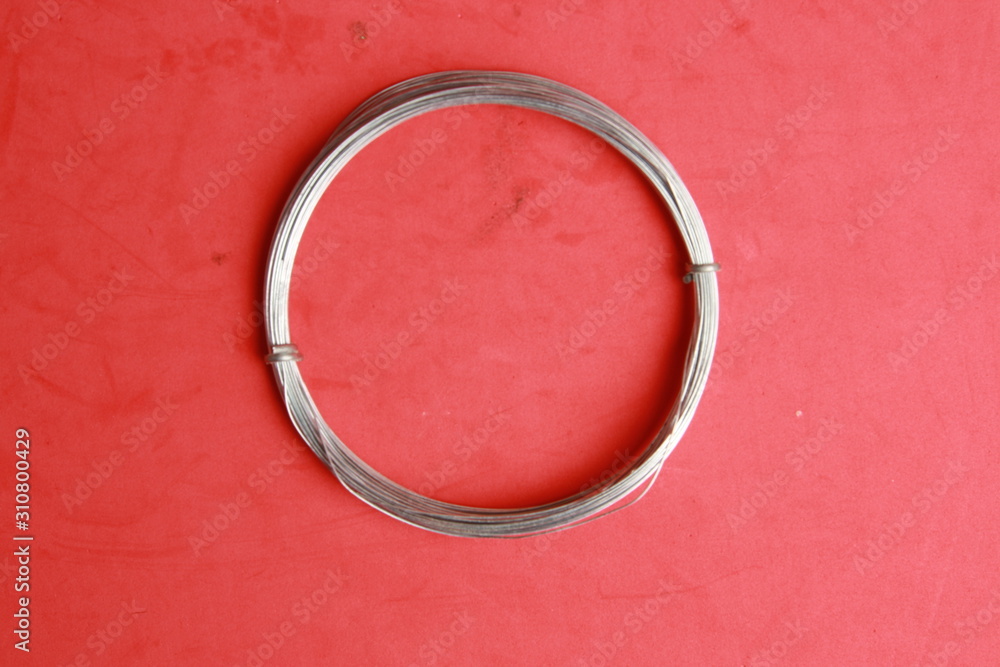 roll of metal wire of hardware store on colored background roll of metal wire of hardware store on colored background