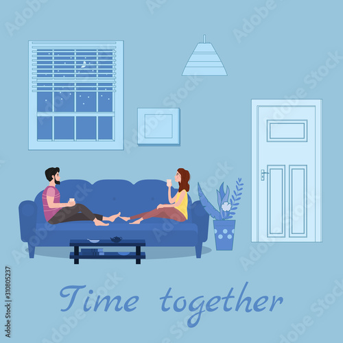 Cute loving couple on cozy sofa, drinking tea or drinks and eating together at home