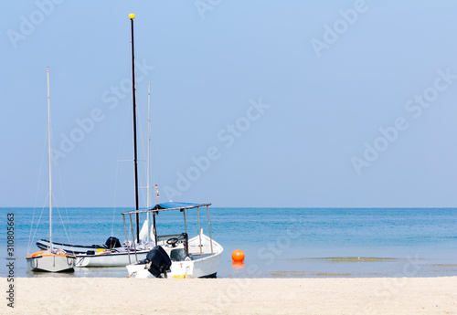 Boats moored on the beach on a sunny day