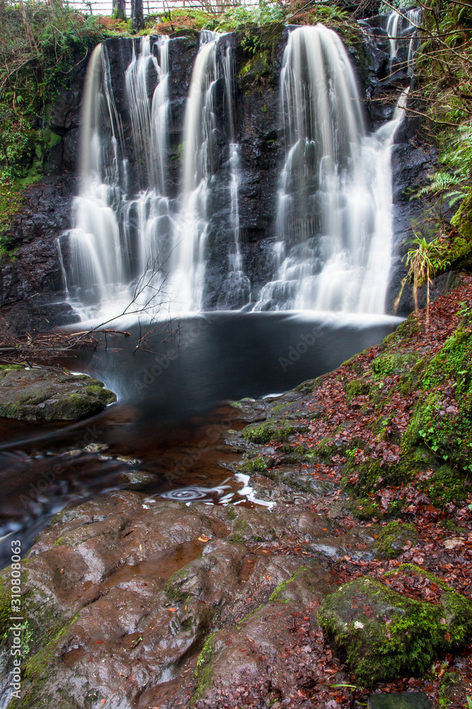 Obraz premium forest waterfall and rocks covered with moss Northen Ireland