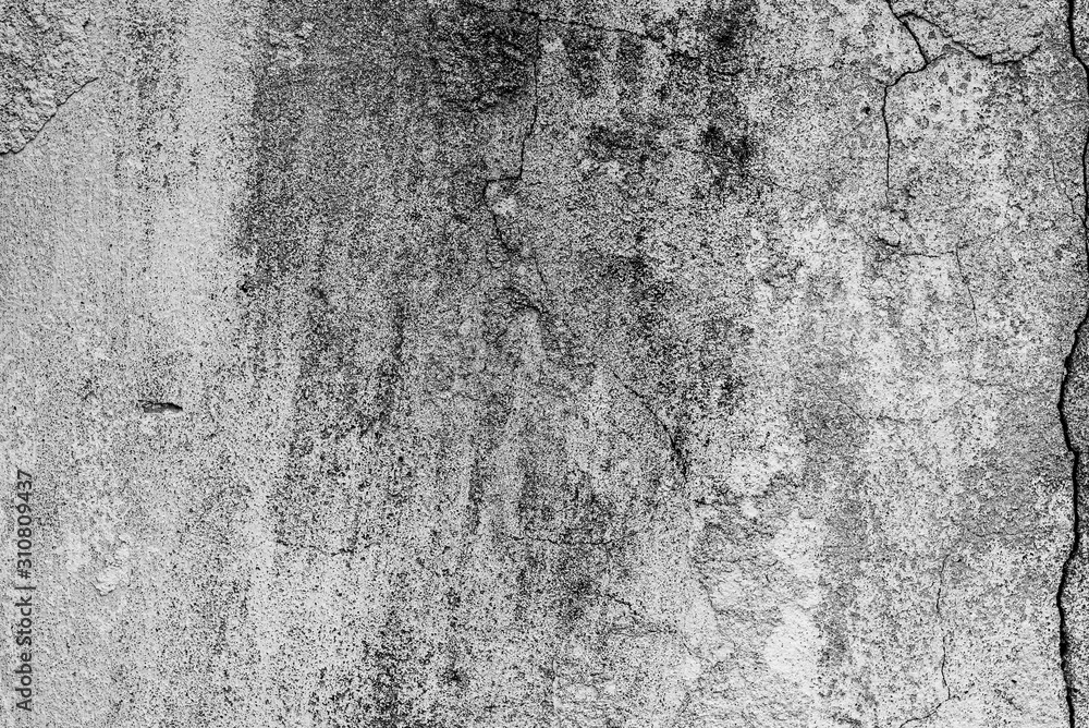 Fototapeta premium Texture of a concrete wall with cracks and scratches which can be used as a background
