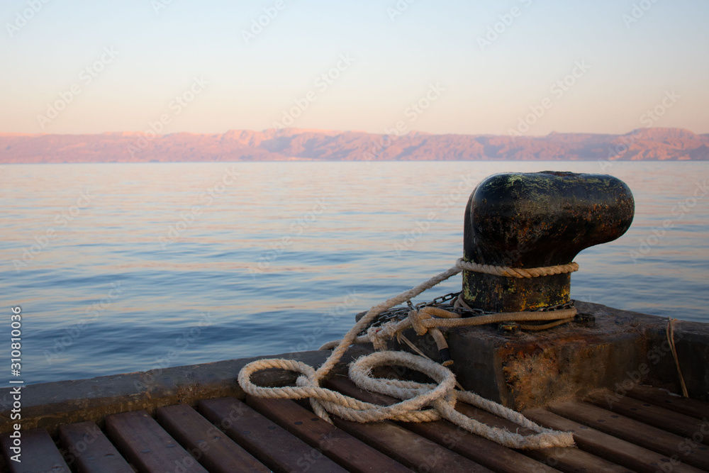 wooden pier on the sea for yachts and boats