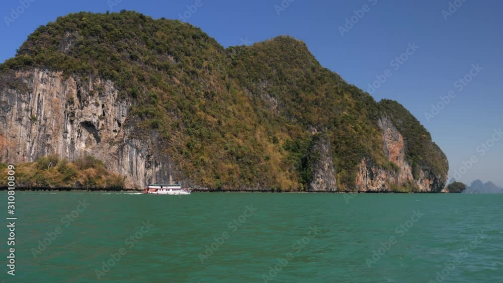 Tourist boat around tropical islands in Thailand. Slow motion Tourist boat around tropical islands in Thailand. Slow motion