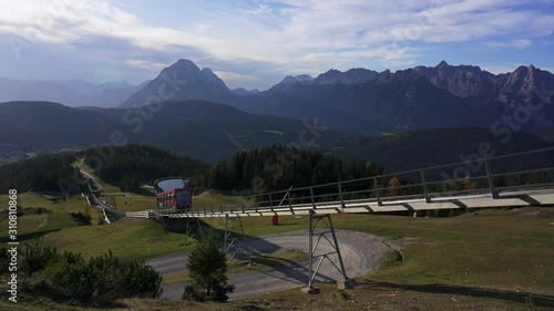 Funicular railway train (Standseilbahn) on the way down from Seefelder Joch toward the resort town of Seefeld in Tirol in the mountains of the alps. Austria photo