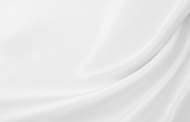 Smooth elegant white silk or satin luxury cloth texture as wedding background. Luxurious background design