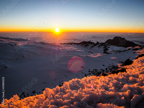 hikers on the ridge ascend mount kilimanjaro the tallest peak in africa.