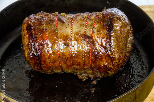 Browning a beef brisket joint , in a frying pan. photo