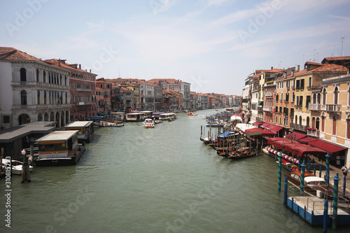 Gondolas on Grand Canal Venice surrounding by historical attractive building, Venice, Italy, Commercial advertisement for day trip boat in Europe