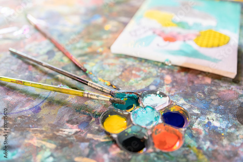 Closeup,artistic tools on colourful table,drawing and palette, paintbrush to painting watercolor on canvas,learning,activity and development of children,creative ideas,education, art concept