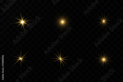 Set of flashes, Lights and Sparkles on a transparent background. Bright gold flashes and glares. Abstract golden lights isolated Bright rays of light.