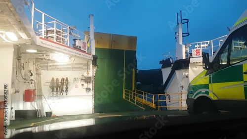 CalMac ferry green ramp lowering for cars to exit boat onto Great Cumbrae Island from Largs photo