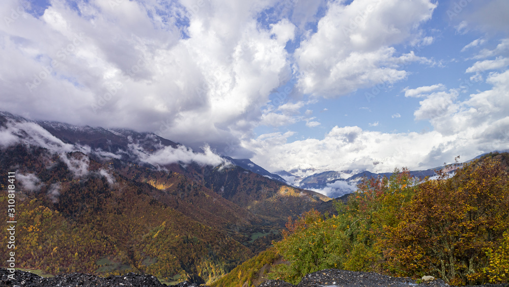 Mountain  slopes covered with forests and low thunderclouds in Svaneti in the mountainous part of Georgia