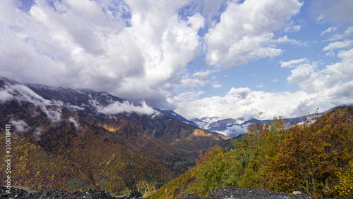 Mountain slopes covered with forests and low thunderclouds in Svaneti in the mountainous part of Georgia