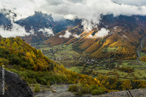 Mountain  slopes covered with forests and low thunderclouds in Svaneti in the mountainous part of Georgia © svarshik