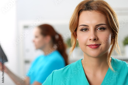 Calm glance of young doctor