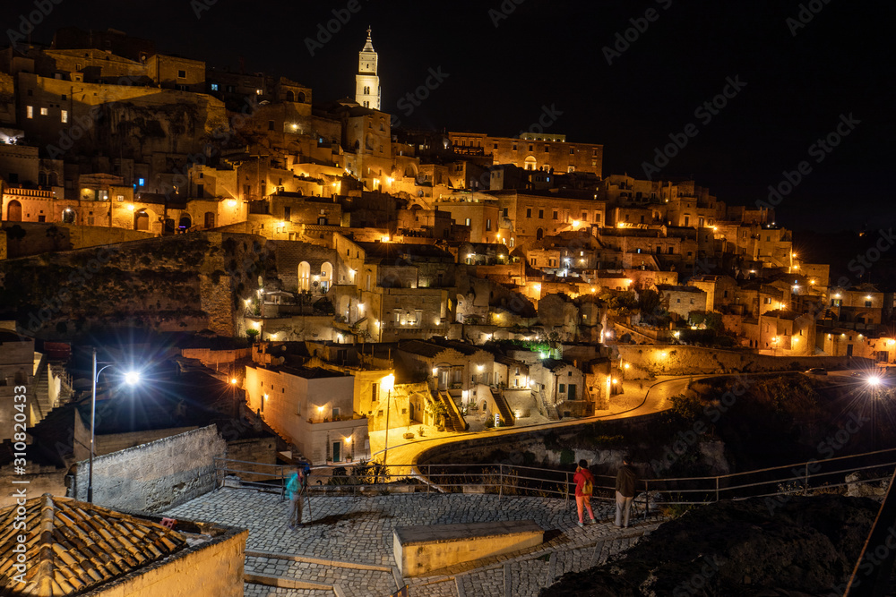 Matera, Italy - September 19, 2019: Night landscape of the Sassi of Matera, well-known for their ancient cave dwellings. Basilicata. Italy