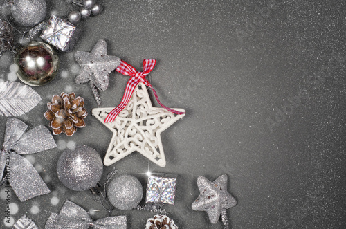 Christmas composition. Silver xmas decoration on gray background. Flat lay, top view, copy space