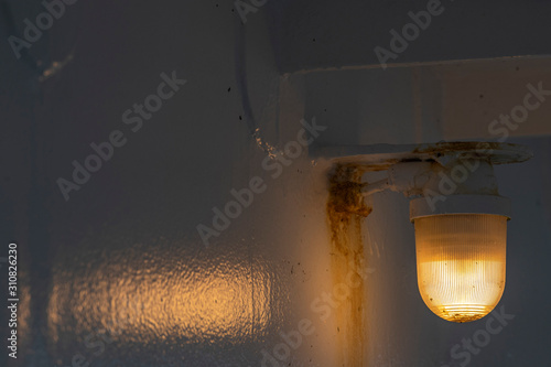 Fotografie Reflective orange colored ship lamp .