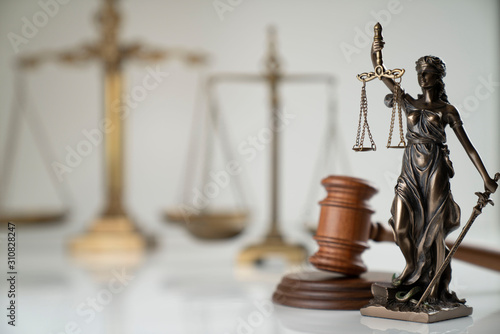 Law symbol composition. Gavel of the judge, Themis statue and scale of justice on off-white background.