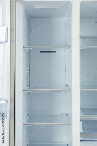Shelves of empty modern refrigerator  closeup view