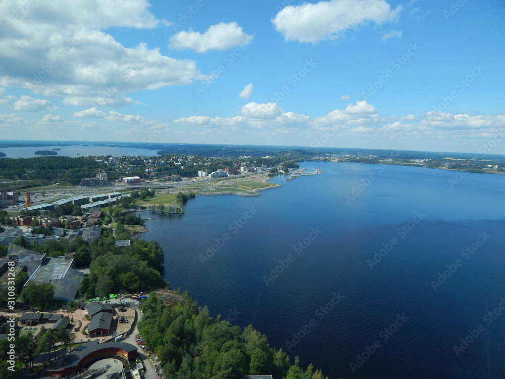 Beautiful panoramic view: summer scenic landscape with a lake and white clouds