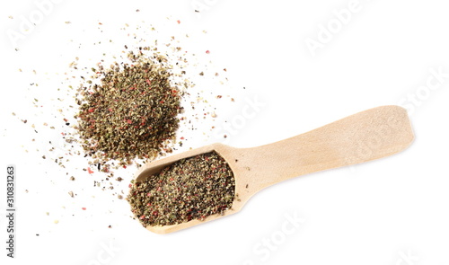 Colorful crushed pepper mix, flakes in wooden spoon isolated on white background, top view
