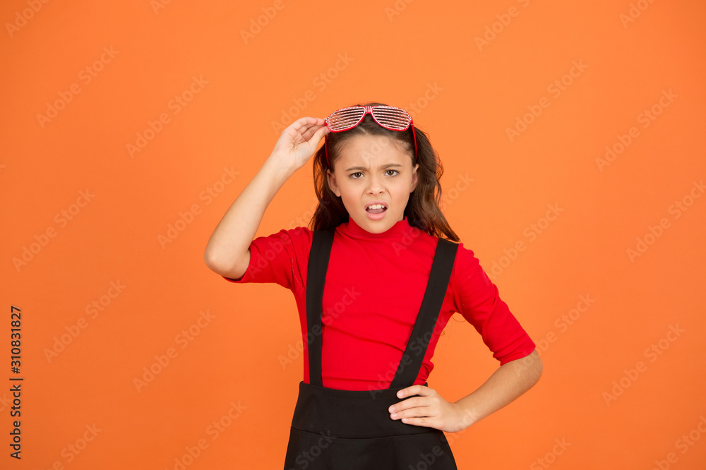 Girl with eyeglasses orange background. Event and entertainment. Party celebration. Party accessory. Having fun. Carnival party. Masquerade concept. Kid wear eyeglasses. Eyewear fashion store Girl with eyeglasses orange background. Event and entertainment. Party celebration. Party accessory. Having fun. Carnival party. Masquerade concept. Kid wear eyeglasses. Eyewear fashion store