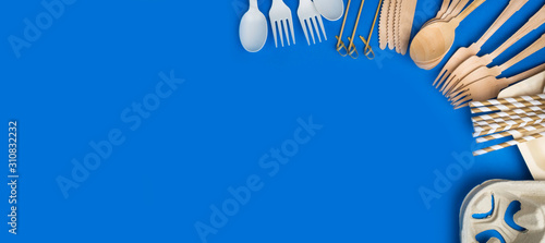 Eco-friendly biodegradable cutlery, Ecological disposable tableware for food on a trendy blue color background