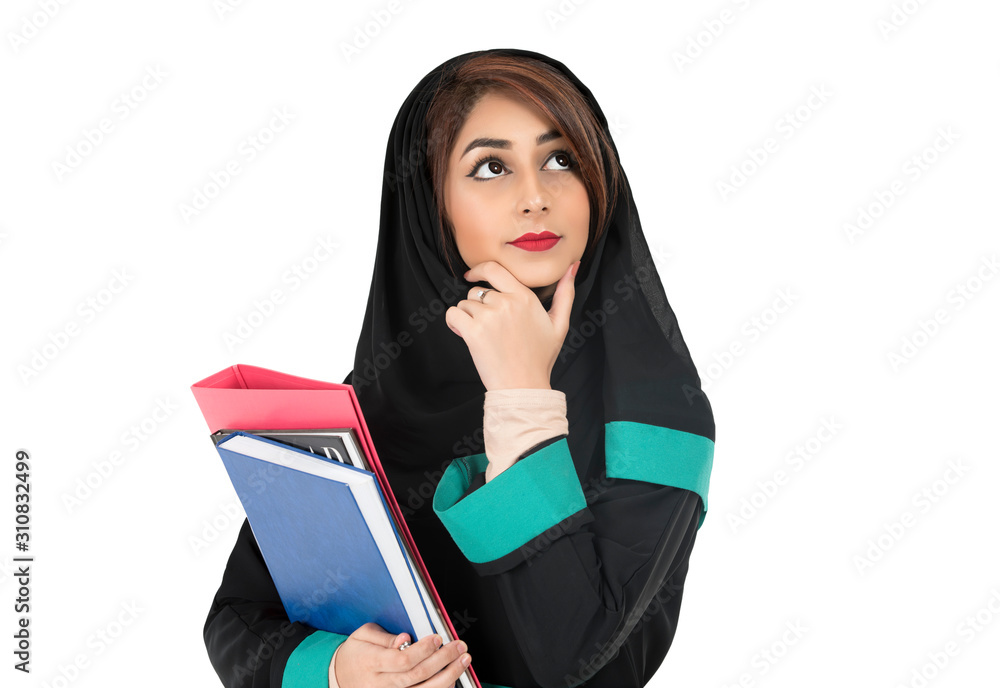 thinker Arabic student wearing hijab and holding a book in her hand thinker Arabic student wearing hijab and holding a book in her hand
