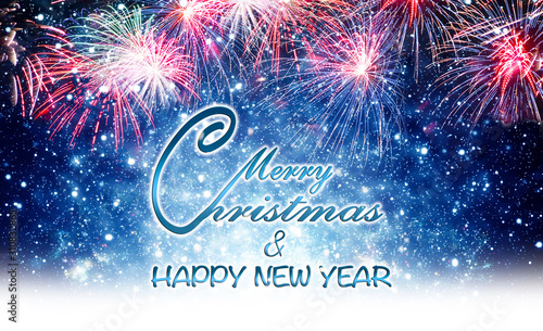 Merry Christmas and Happy New Year - Christmas card with fireworks and snow
